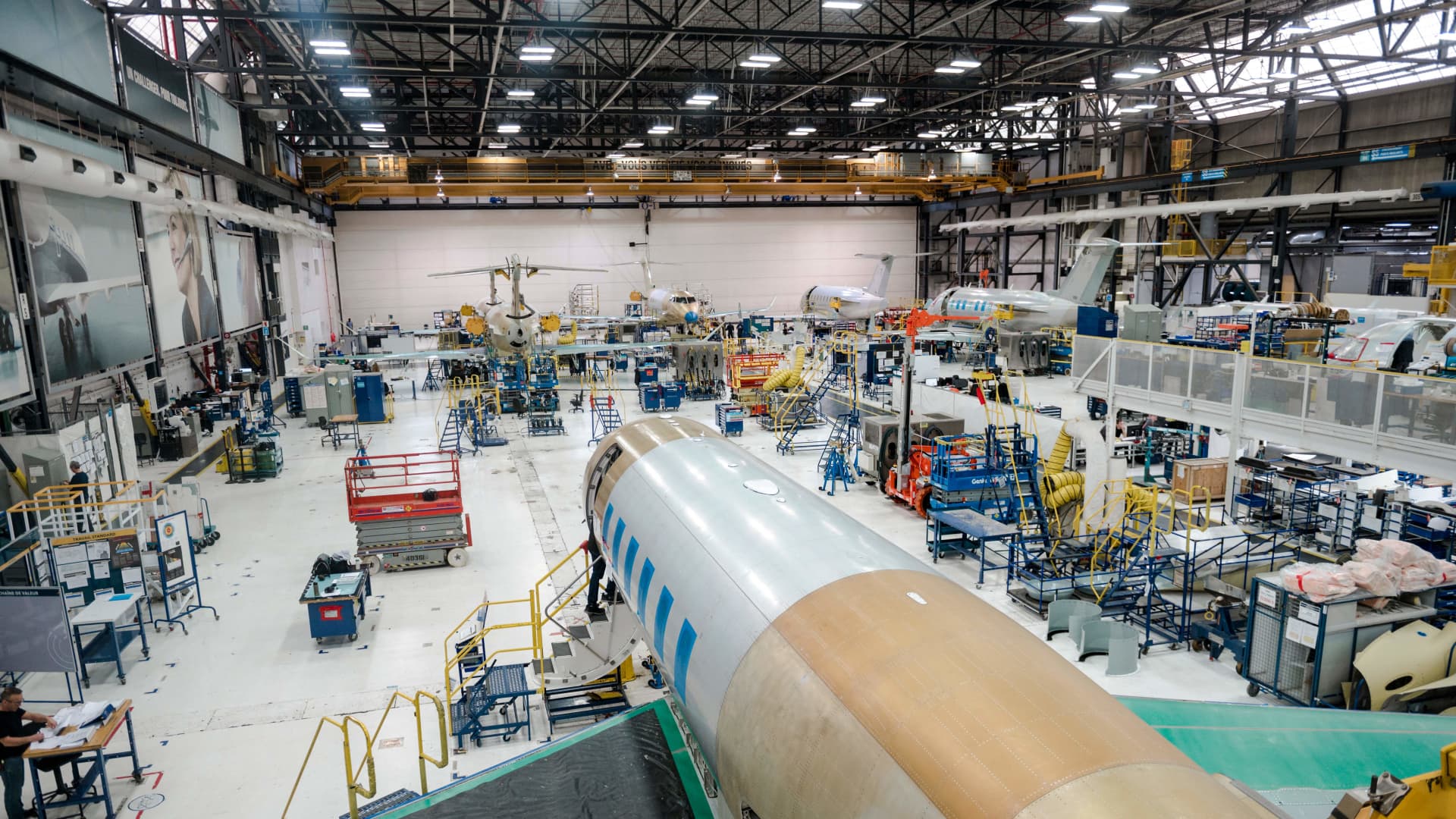 Aircraft are assembled at the Bombardier Challenger Assembly Hall during Bombardier's 2023 Investor Day on March 23, 2023, in Dorval, Quebec, Canada. (Photo by ANDREJ IVANOV / AFP) (Photo by ANDREJ IVANOV/AFP via Getty Images)