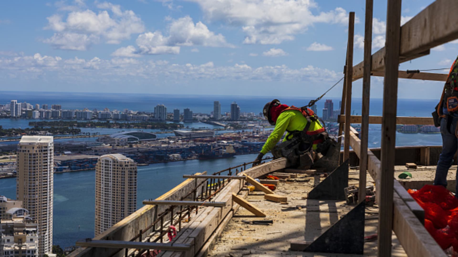 Contractors work at a Miami office tower under construction in September 2022. 