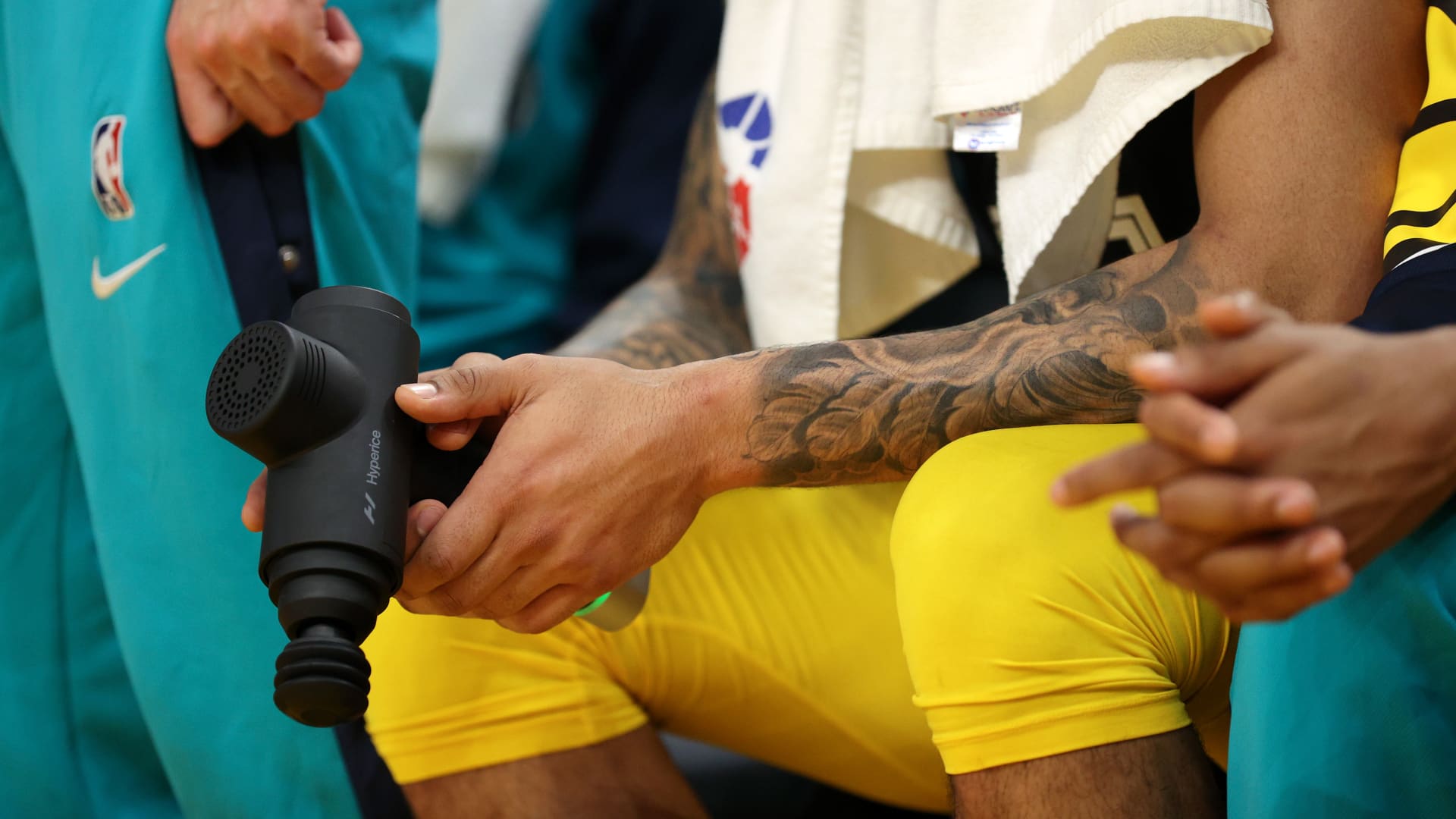 Percussive massagers can regularly be seen being used by athletes on the sidelines of NBA games.