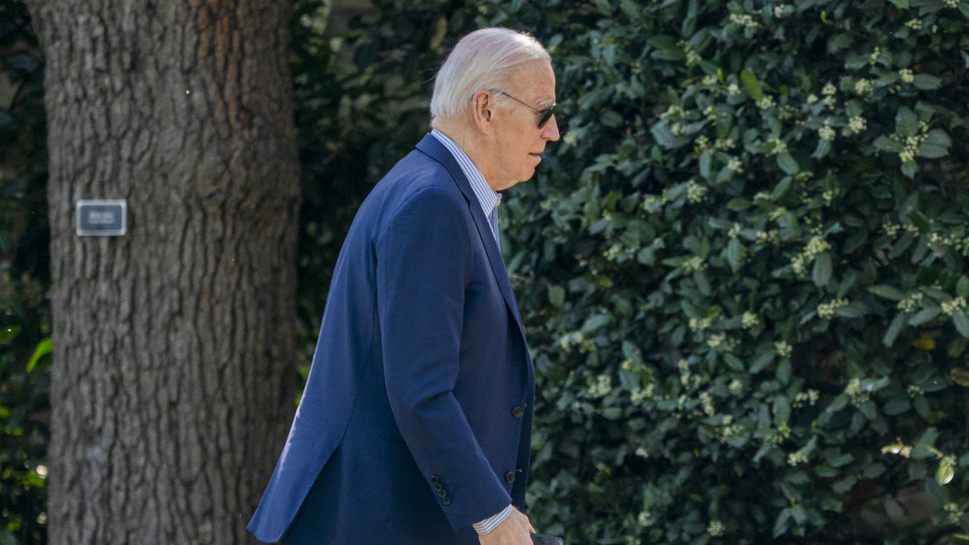 US President Joe Biden walks on the South Lawn of the White House after arriving in Washington, DC, US, on Saturday, April 13, 2024. 