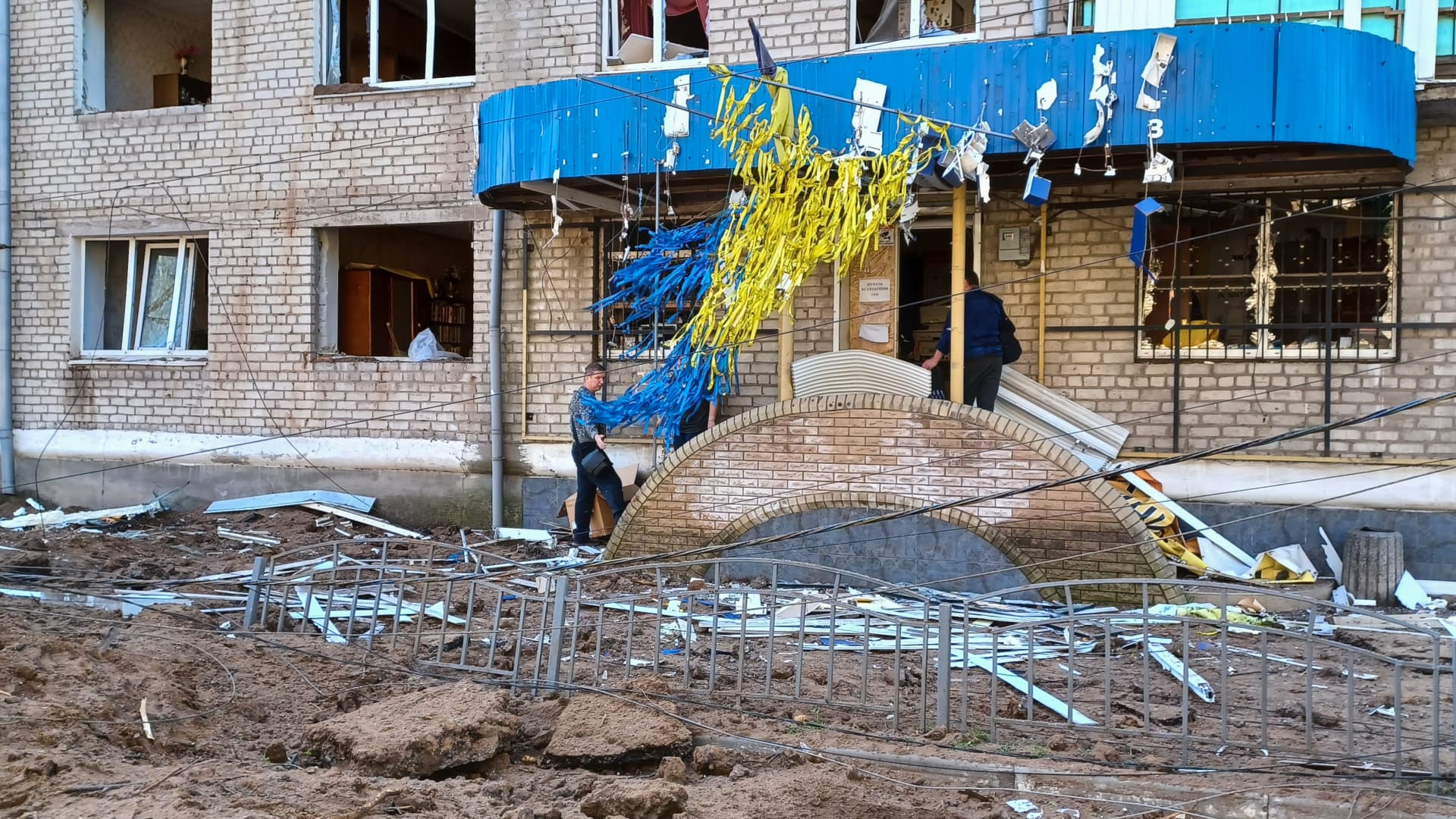 Store workers clean up debris following a missile strike on April 15, 2024 in Sloviansk, Donetsk Oblast, Ukraine.
