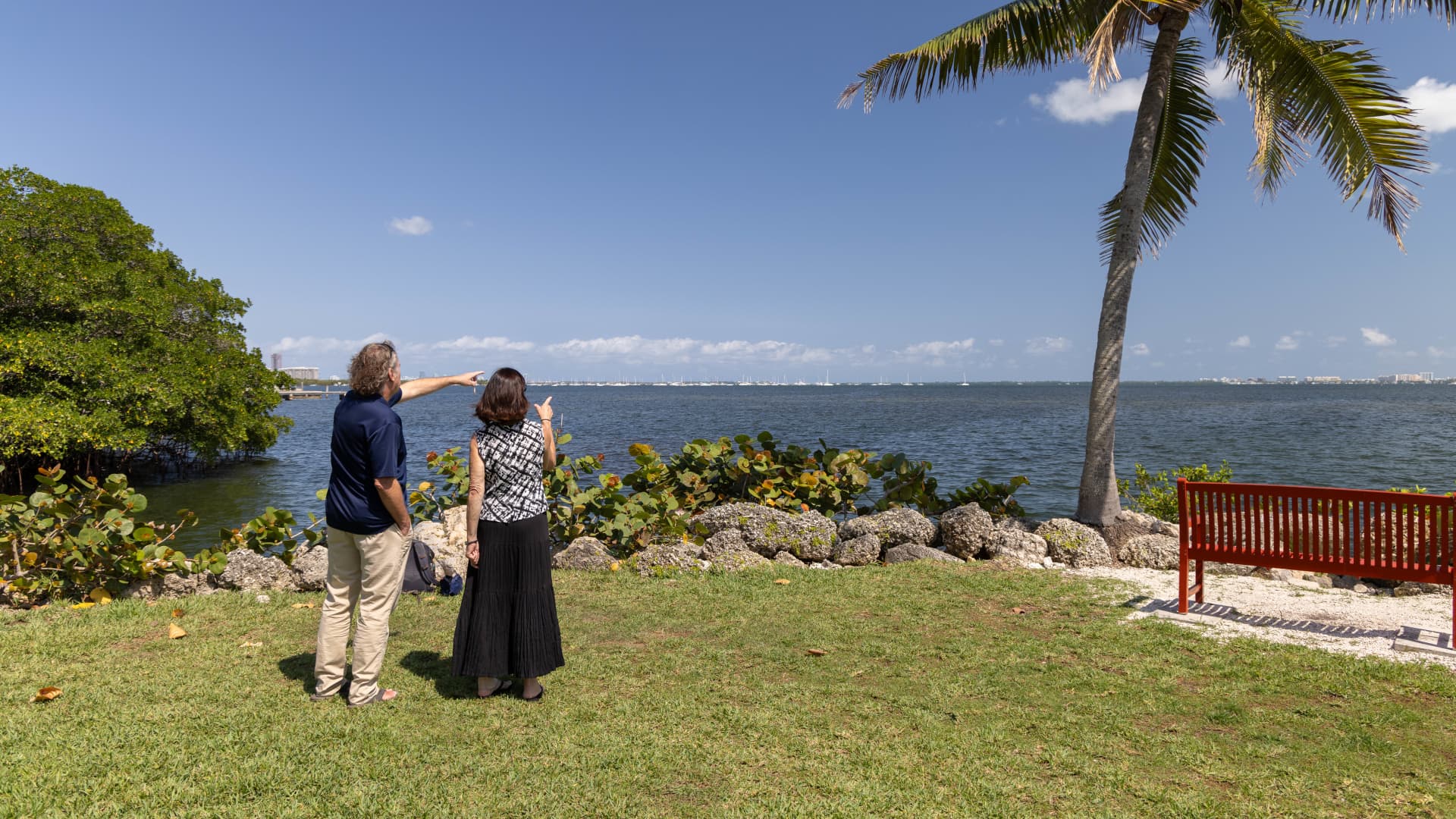 Todd Crowl and Rita Teutonico of Florida International University look toward Biscayne Bay. At left is one of the City of Miami's few remaining stands of mangroves.