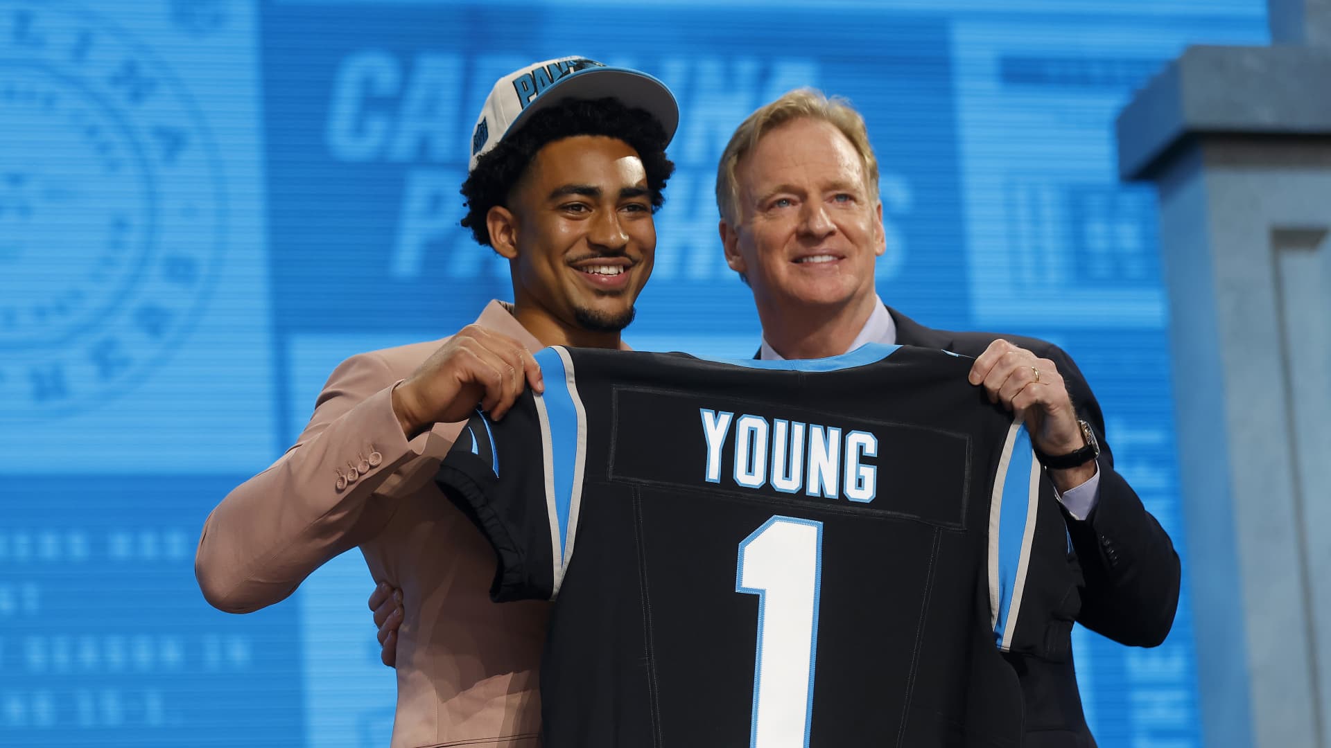 Bryce Young poses with NFL Commissioner Roger Goodell after being selected first overall by the Carolina Panthers during the first round of the 2023 NFL Draft.
