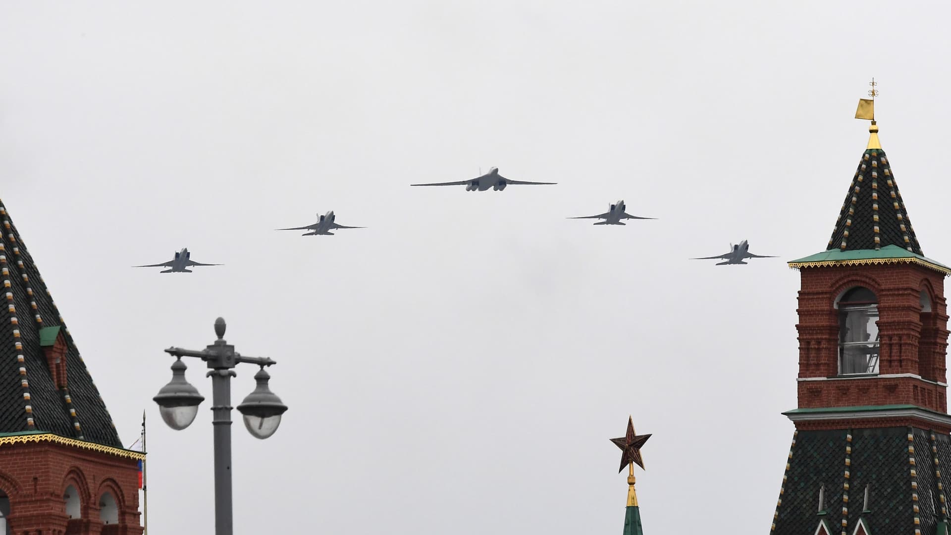 A Tupolev Tu-160 and Tu-22M3 military aircrafts fly over the Kremlin and Red Square in downtown Moscow to mark the 75th anniversary of the victory over Nazi Germany in World War Two, May 9, 2020.