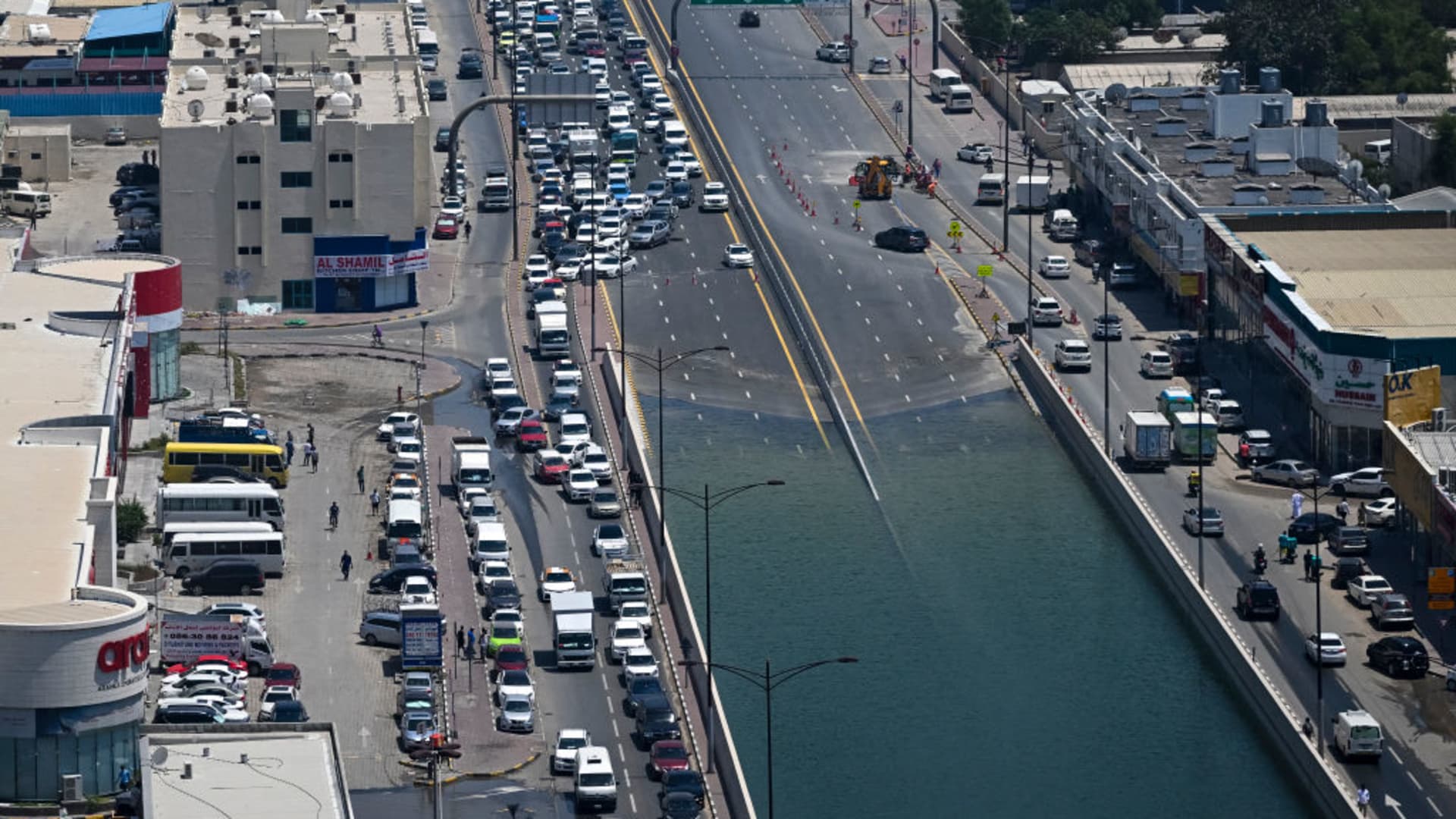 Traffic diverts away from a flooded street in Sharjah on April 20, 2024, after the heaviest rainfall on record in the UAE.