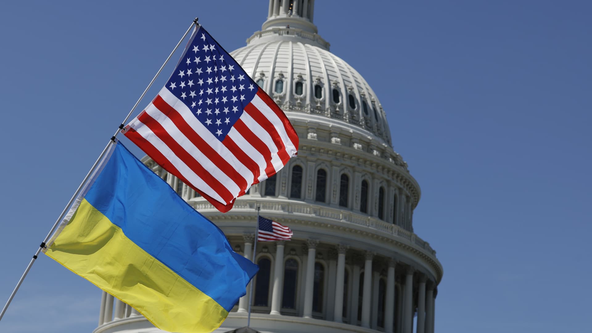 Flags for the United States and Ukraine billow in the wind off an activist's bicycle on the East Front Plaza of the U.S. Capitol Building on April 23, 2024 in Washington, DC. 