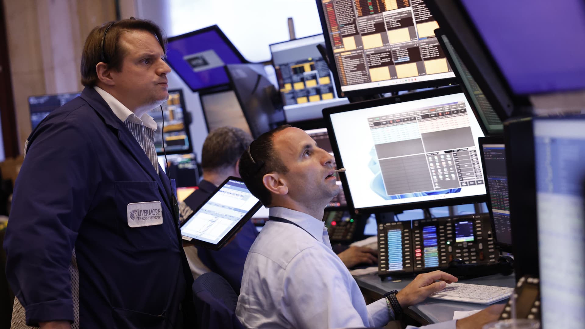 Traders work on the floor of the New York Stock Exchange during morning trading on April 29, 2024.