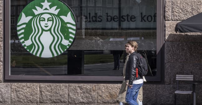 Starbucks shares sink 12% as coffee chain slashes 2024 forecast amid same-store sales drag