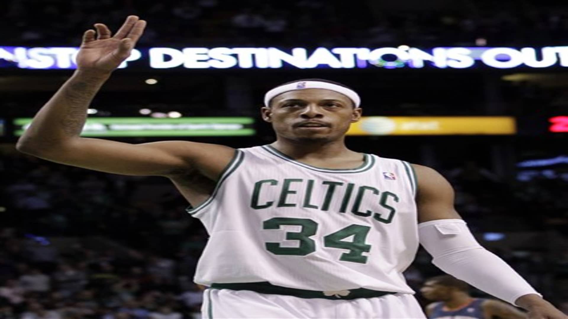 Boston Celtics forward Paul Pierce waves to the crowd after reaching No. 2 on the all-time Celtics scoring list, surpassing Larry Bird, during the second half of an NBA basketball game against the Charlotte Bobcats in Boston on Tuesday, Feb. 7, 2012. (AP Photo/Elise Amendola)