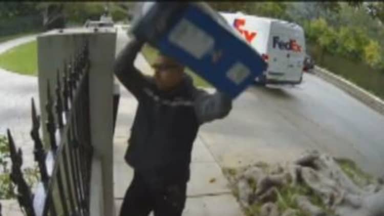 FedEx Man Throws Monitor Over Fence